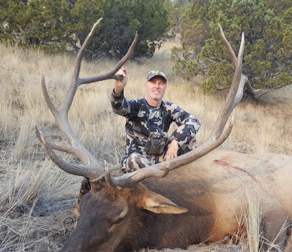 Rick Searcy with a bull elk harvest in the high country
